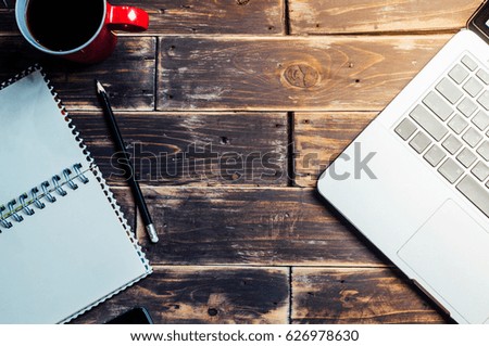 Laptop on wood desk with copy-space for background concept,vintage tone, business background concept.
