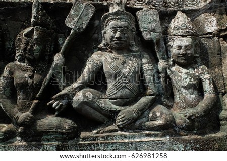 low relief carving pictures  into works of art of Khmer. inside Angkor wat