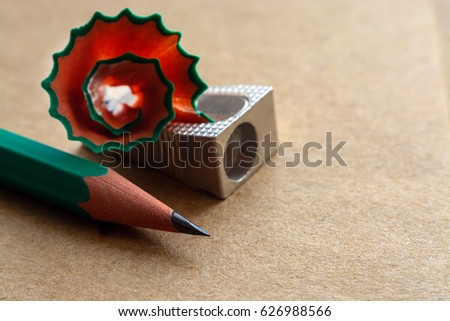 sharpener for pencils on craft paper with traces of pencil