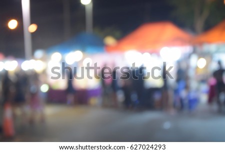 blur image people walking street night market with bokeh
