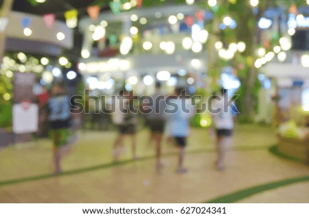 blur image people walking street night market