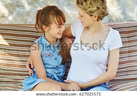 happy mom with daughter kissing. Mother and child