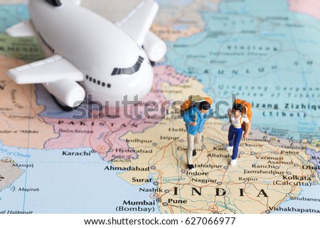 Two traveller model walking on map together, people travel in india, travel concept. Royalty-Free Stock Photo #627066977