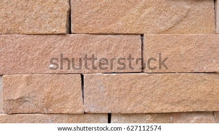 The brown brick wall for creating background or texture.