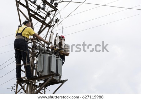 Electricians repairing wire of the power line