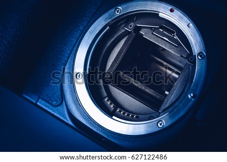 close-up of Dslr lense mount. A blue tone of digital single lense reflextion detail.