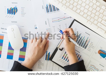 Business woman working at office with documents