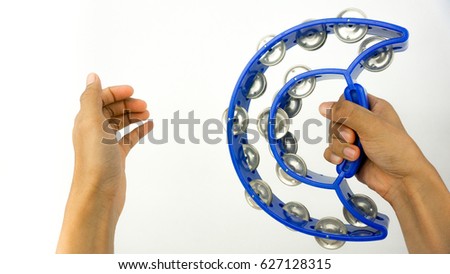 percussionist hold blue tambourine isolated on white background