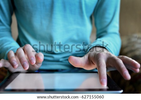 Person typing on tablet connecting communications on the internet