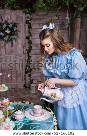 Alice pouring tea into the cup