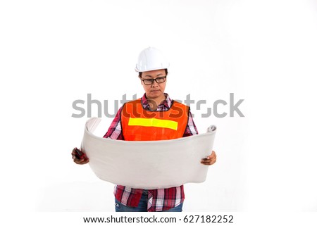 Women engineer holding blueprint on construction site