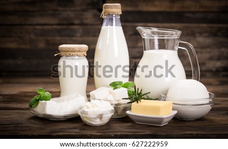 Fresh dairy products on the wooden table Royalty-Free Stock Photo #627222959