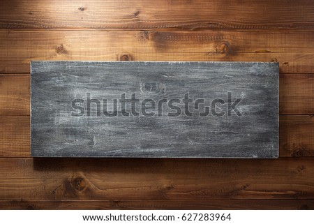 wooden board at brown plank background
