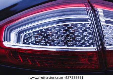 car headlights, red and blue. Garage theme