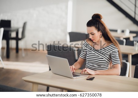 Attractive Woman use Laptop huge Loft Studio. Student Researching Process Work. Creative Startup modern Office. Analyze market stock, new strategy. Blurred, Horizontal.