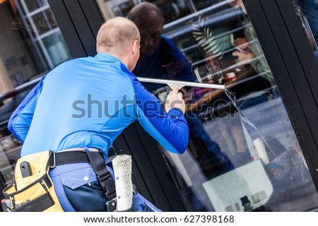 window washer working  wash glass on building
 Royalty-Free Stock Photo #627398168