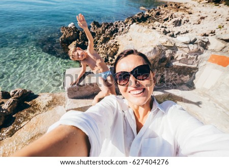 Mother with son take vacation selfie photo in Adriatic Sea Bay