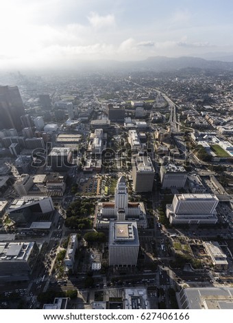 Afternoon aerial view of downtown Los Angeles Civic Center office buildings and the Hollywood Freeway.  