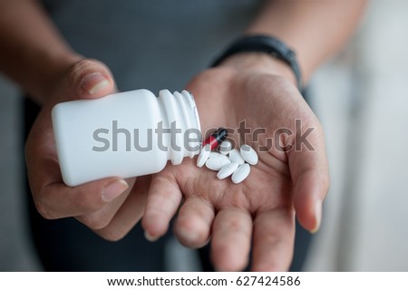 Female Hands with Prescription Drugs, Patient hands on Medication prescribed by Doctor. Royalty-Free Stock Photo #627424586