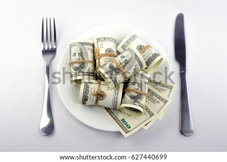 Money salad cash in plate hundred dollar bills on white background