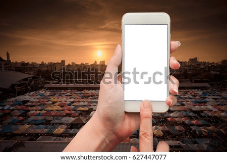 female hand holding mobile smart phone touch screen showing white screen for insert text and picture over the market 