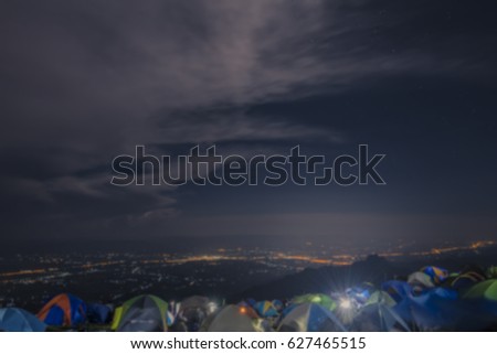 Blured image, tourist tent in camp on the hill. Night Hours Campsite. Recreation and Outdoor Photo Collection.