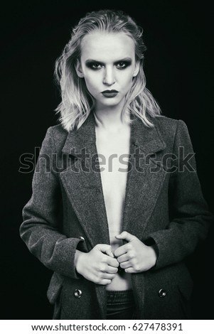 stylish blonde in coat. fashion photo