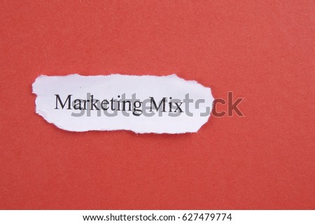 Marketing conceptual word on torn paper.
