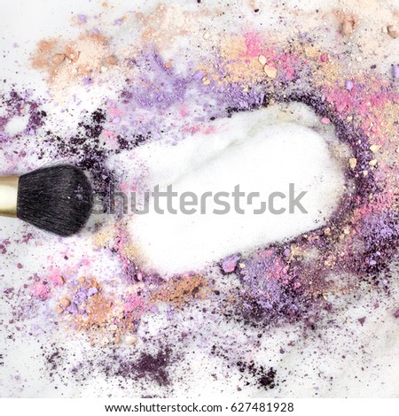 Makeup brush on white marble background, with traces of powder and blush forming a frame. A square template for a makeup artist's business card or flyer design, with copy space