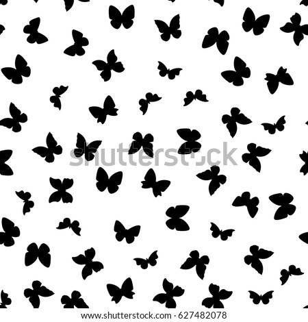 Random black and white butterflies silhouettes pattern. 