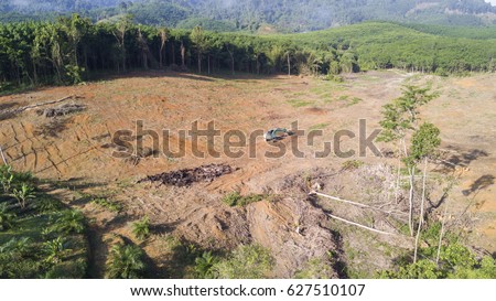 Deforestation. Aerial drone photos of logging environmental destruction of rainforest in Thailand. Forest land cleared for oil palm plantations.