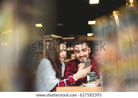 Self portrait making at restaurant couple enjoying together. Photo mobile posing for social networks.