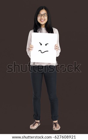 Asian girl holding placard studio portrait
