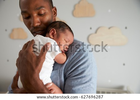 Father Holding Newborn Baby Son In Nursery Royalty-Free Stock Photo #627696287
