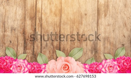 pink roses on a wooden background, vintage color.