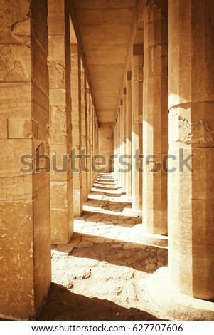 Colonnade of ancient columns at  the Temple of Queen Hatshepsut at Luxor (Egypt ). Edited as a vintage photo with dark edges.