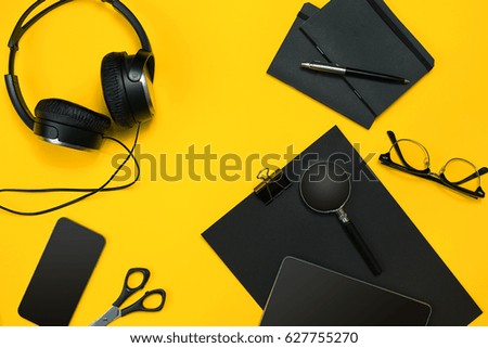Workplace with office items and business elements on a desk. Con