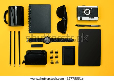 Workplace with office items and business elements on a desk. Con