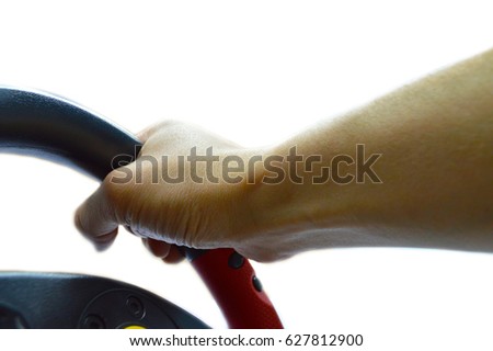 Hand holds the steering wheel on a white background