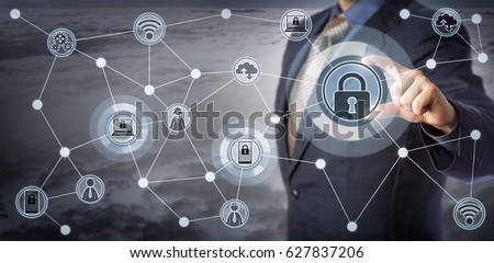Blue chip executive locking laptop and mobile in a wireless communication network. Concept for internet of things security, smart devices management, remote access control and mobility as a service. Royalty-Free Stock Photo #627837206