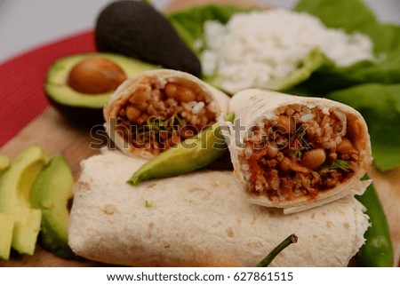 Healthy burrito with chili con carne and avocados