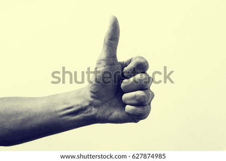 Isolated thumb up representing good and positive conceptual communication. Vintage effect