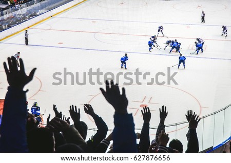 Hands of fans during ice hockey game  Royalty-Free Stock Photo #627876656