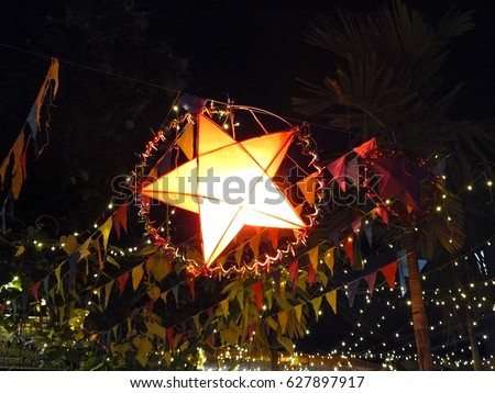 Star Lantern shining up on the road of night market at the 13 Apr. on Cambodia New Year. The Star Lantern is traditional sign of Cambodia New Year.