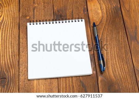 Blank Papers and Pen on Wooden Table