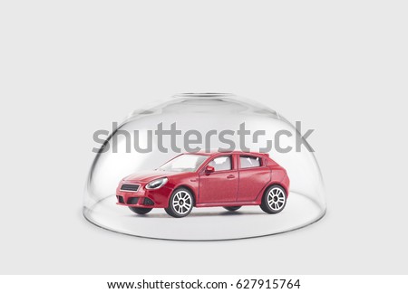 Red car protected under a glass dome Royalty-Free Stock Photo #627915764