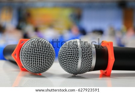 microphone wireless in a meeting room seminar conference background: Select focus with shallow depth of field.
