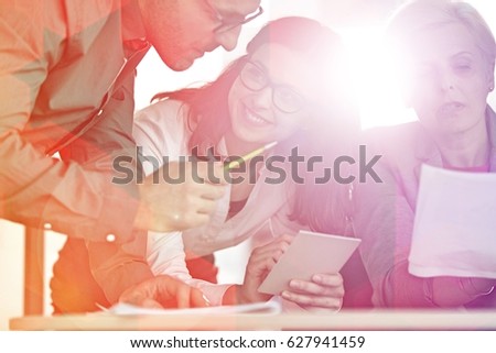 Business people having discussion at table in office