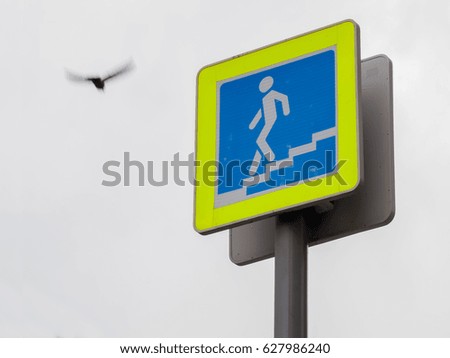 Road sign of a pedestrian crossing