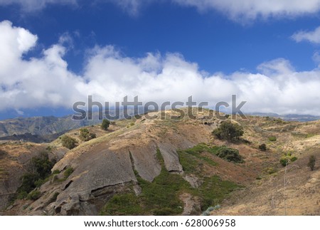 Inland Gran Canaria, April, soft eroded mountain Montana de Bermejal, the central moutains Las Cumbres in the background
